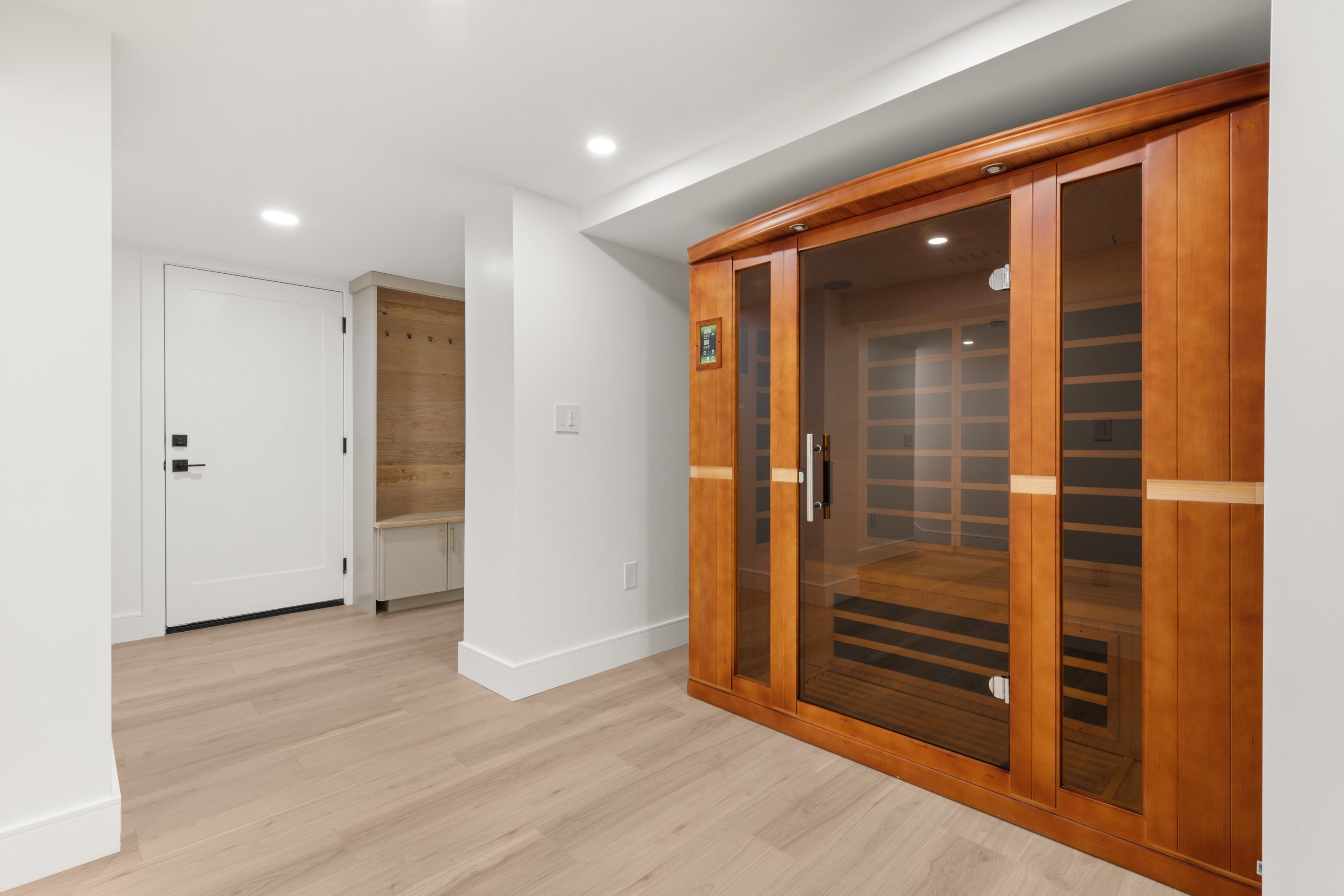 Custom infrared sauna installation in lower level